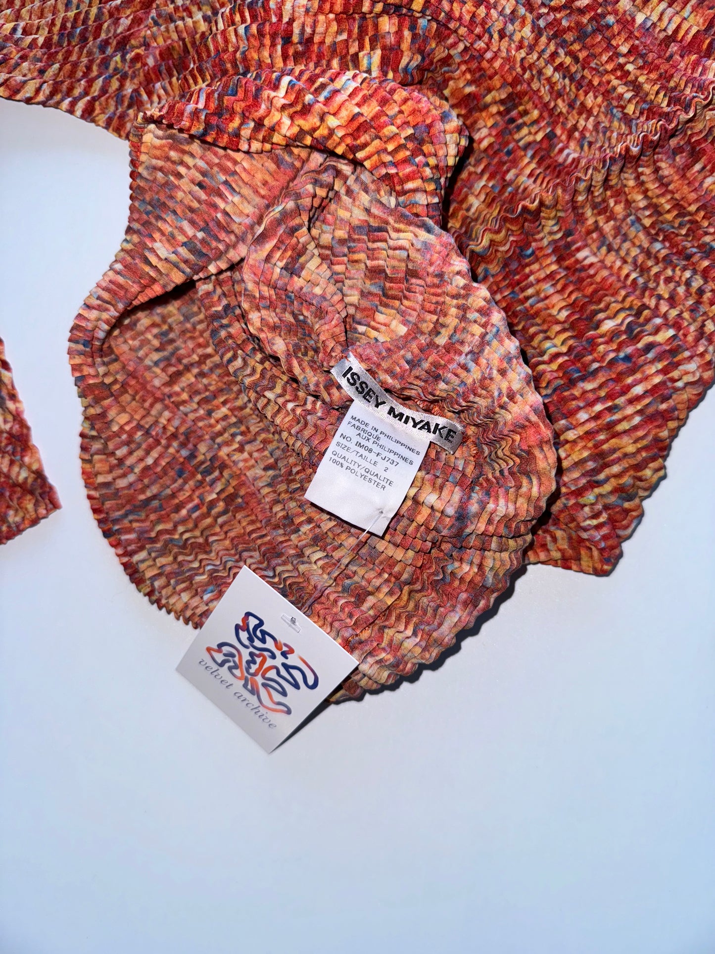 Issey Miyake red pleated longsleeve