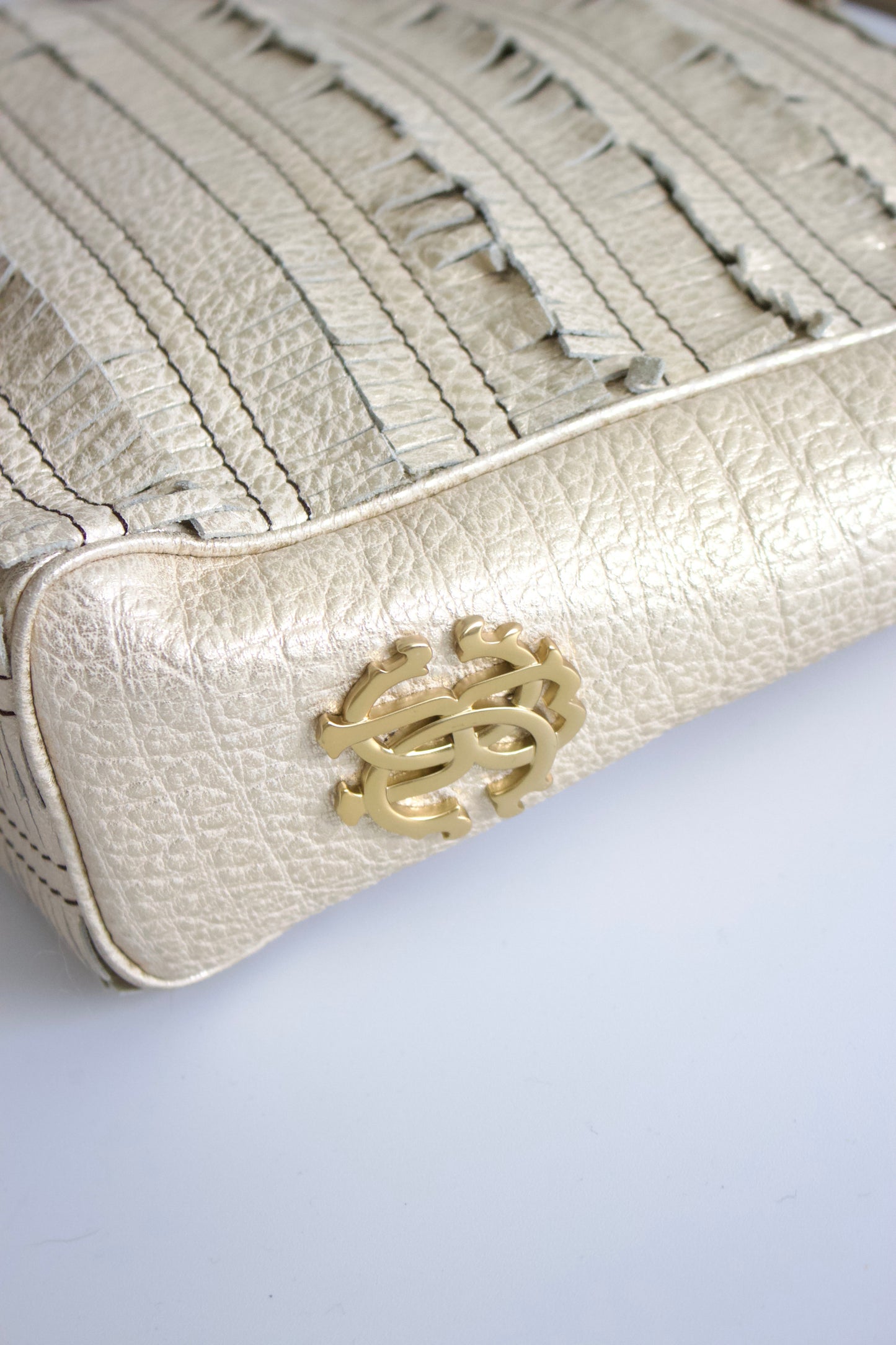 Roberto Cavalli golden leather handbag with fringe appliqué