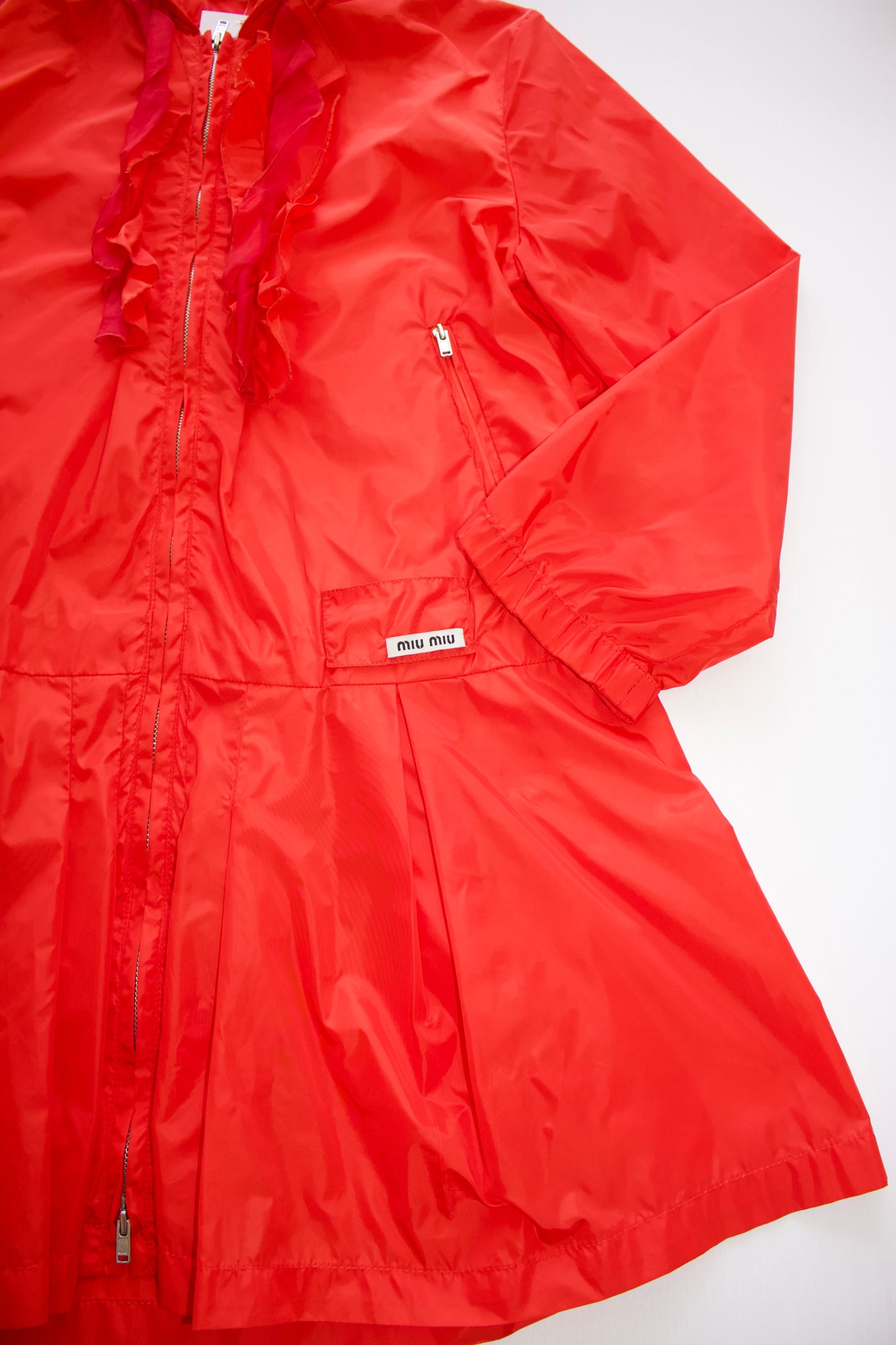 Miu Miu orange nylon raincoat with ruffles