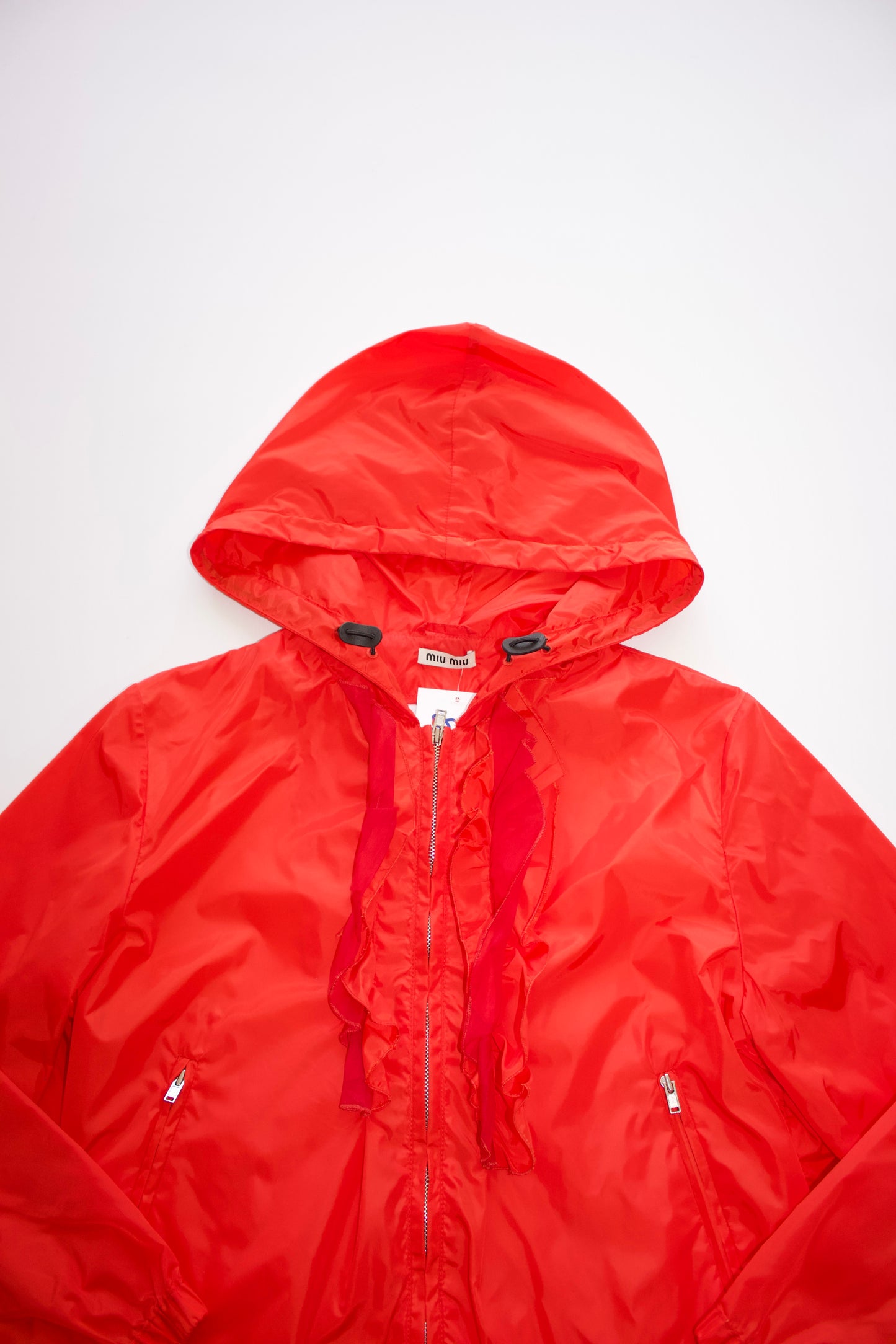 Miu Miu orange nylon raincoat with ruffles