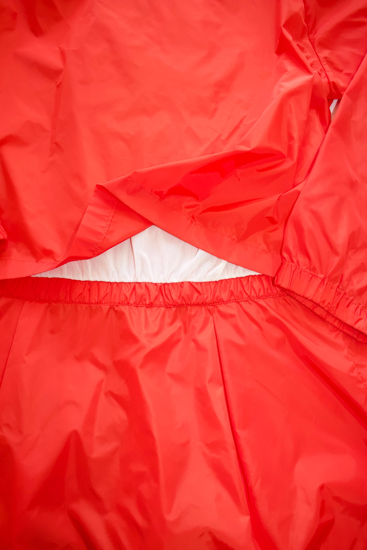 Miu Miu orange nylon raincoat with ruffles