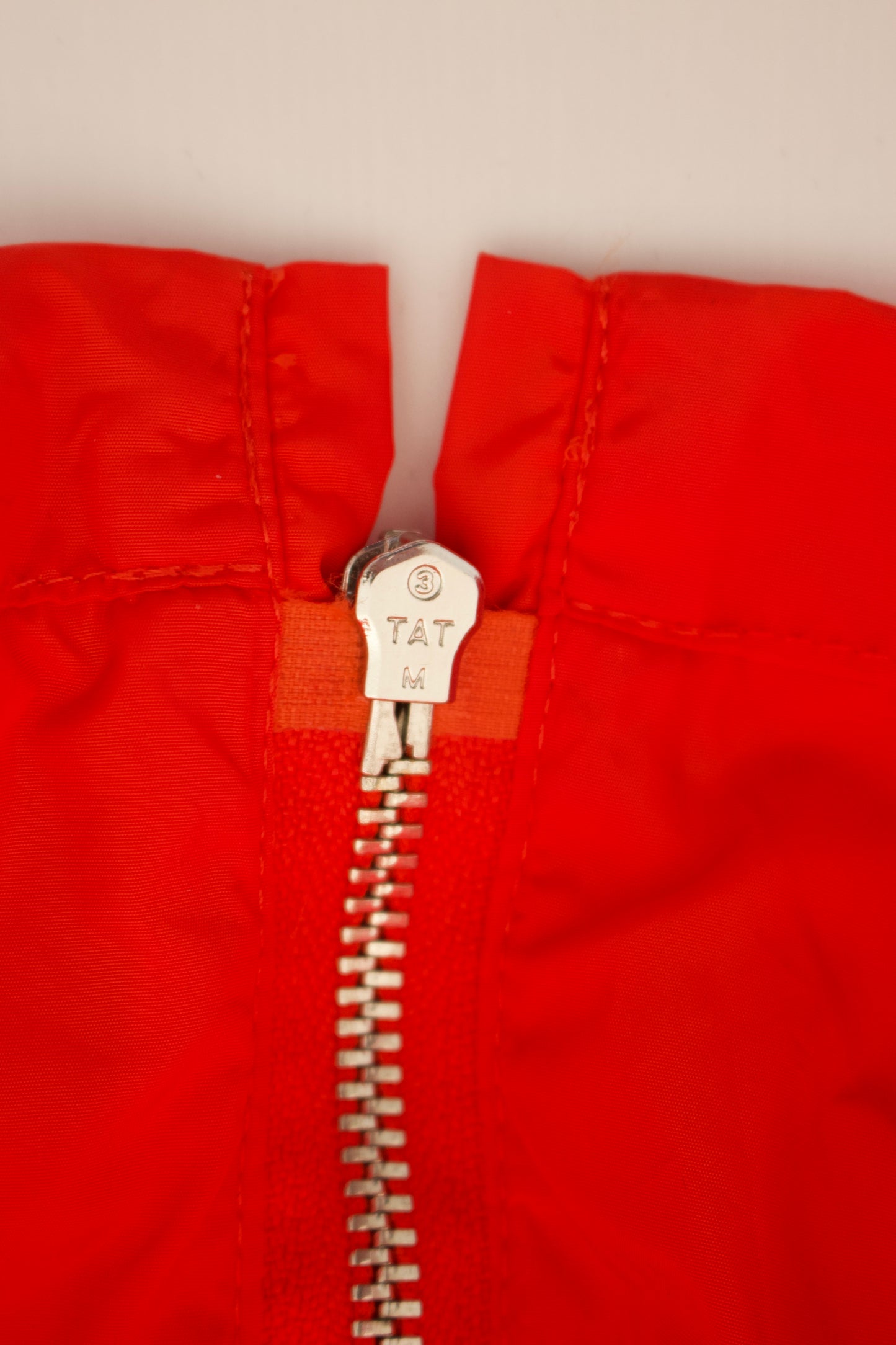 Miu Miu orange nylon raincoat with ruffles