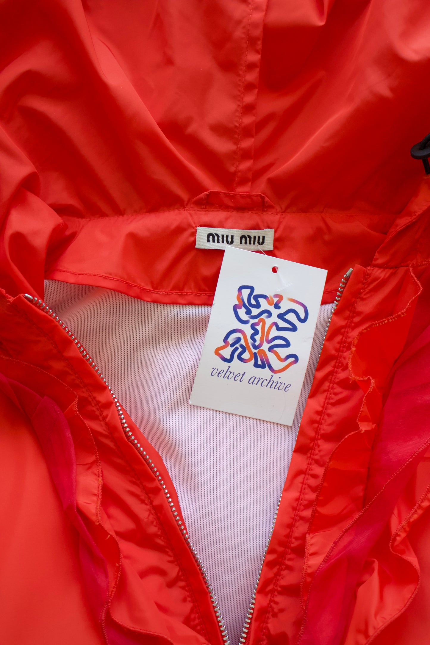 Miu Miu orange nylon raincoat with ruffles