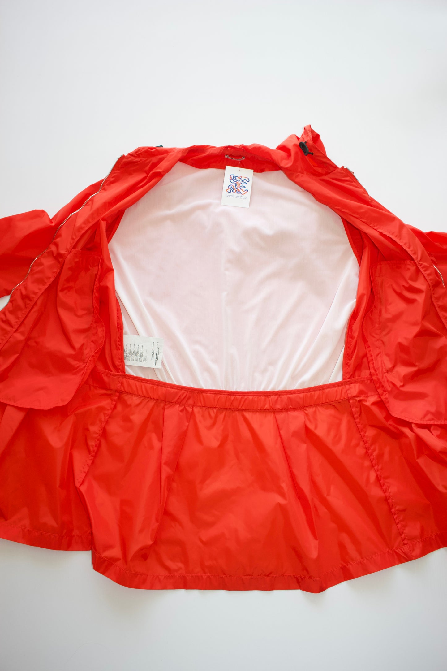 Miu Miu orange nylon raincoat with ruffles