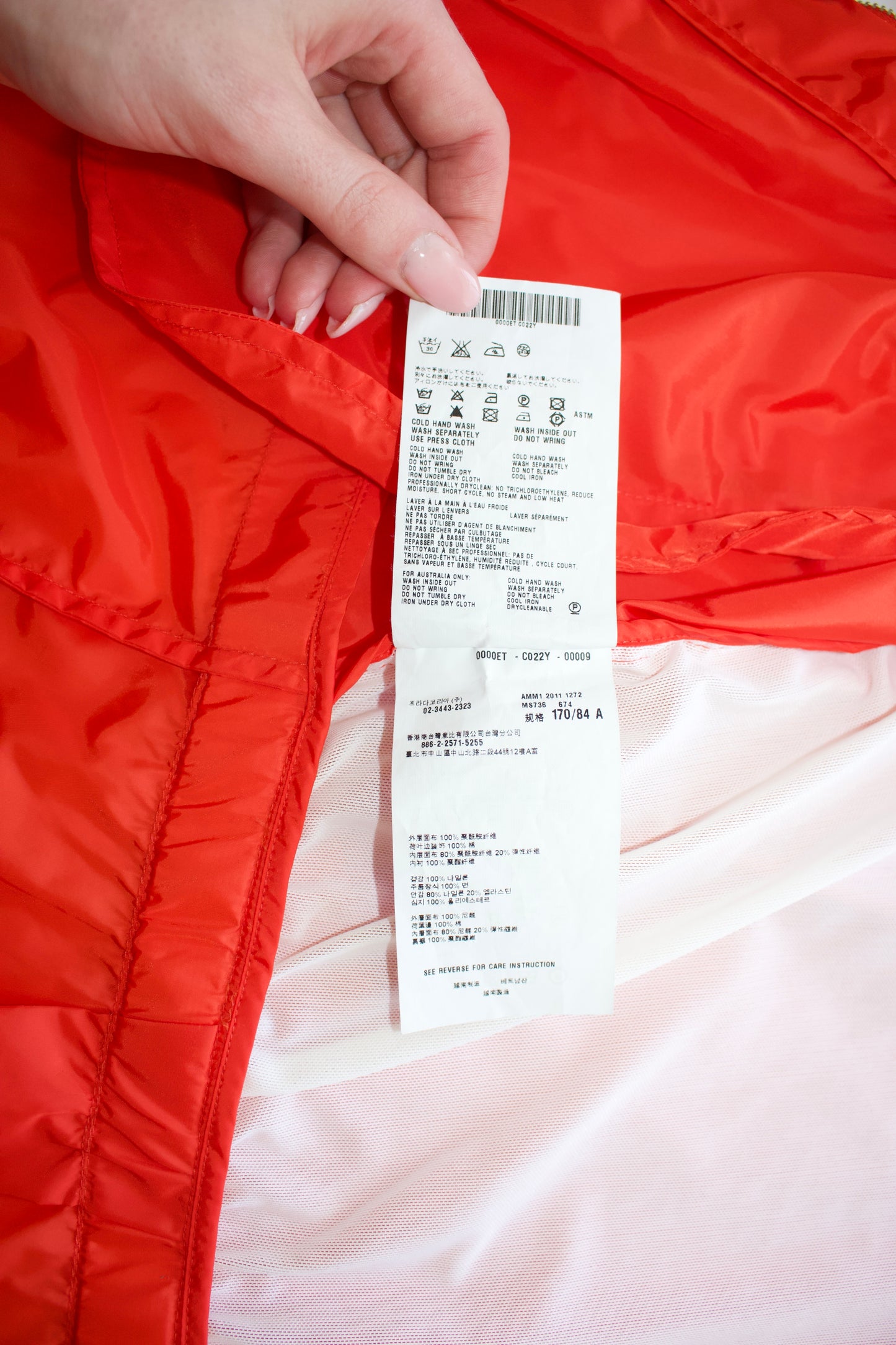 Miu Miu orange nylon raincoat with ruffles