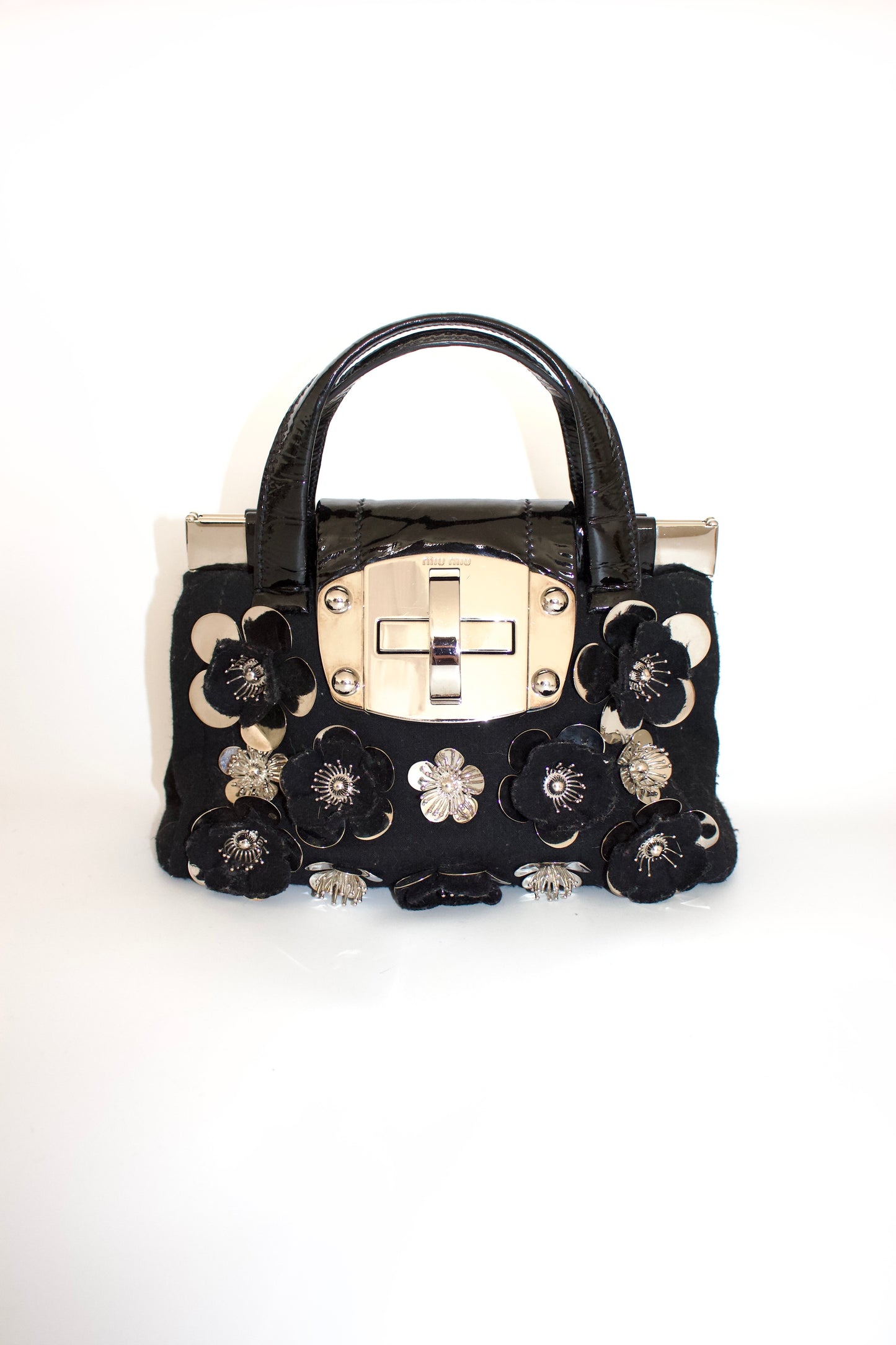 Miu Miu FW2010 black handbag with metallic flowers