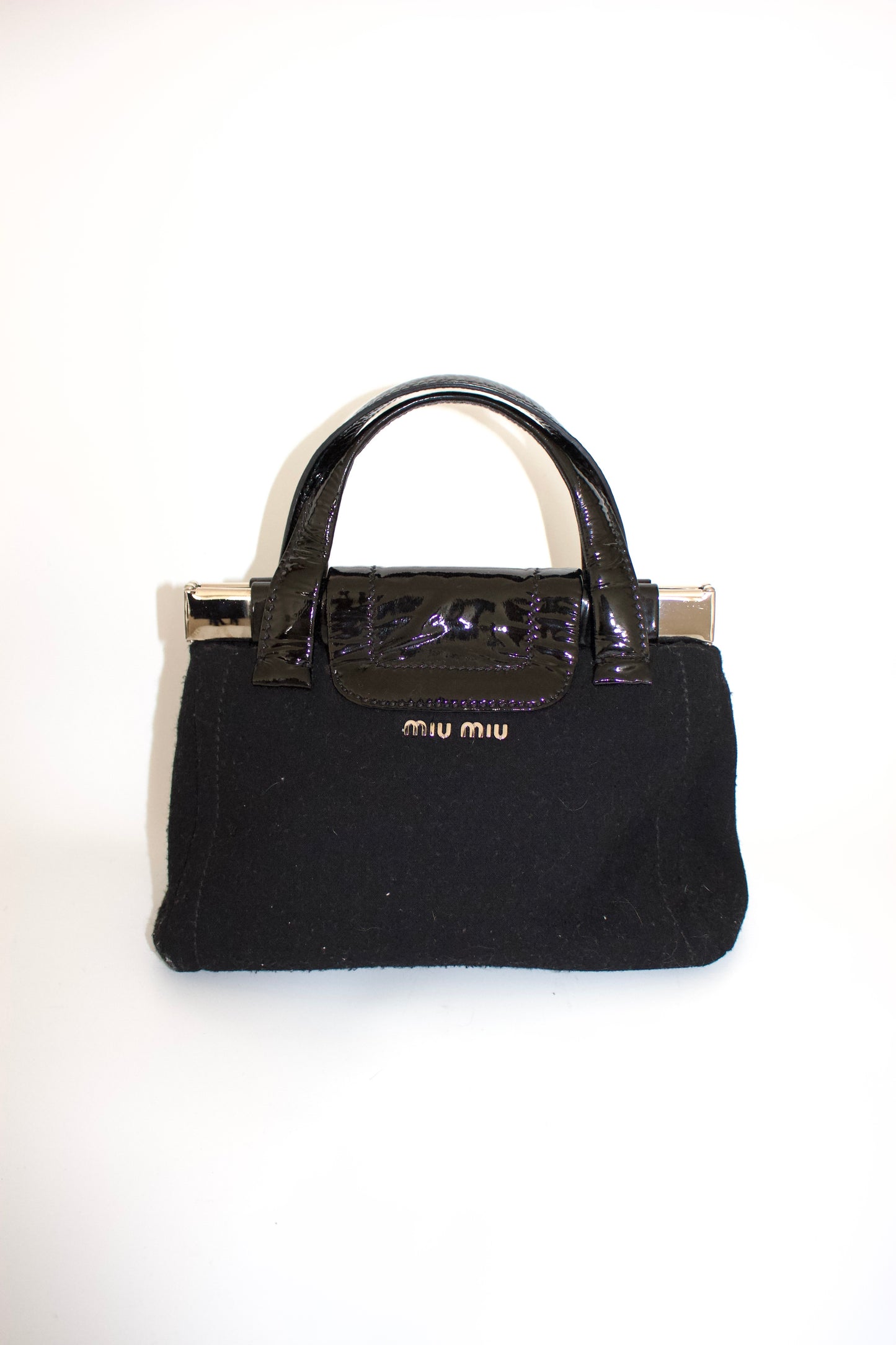 Miu Miu FW2010 black handbag with metallic flowers