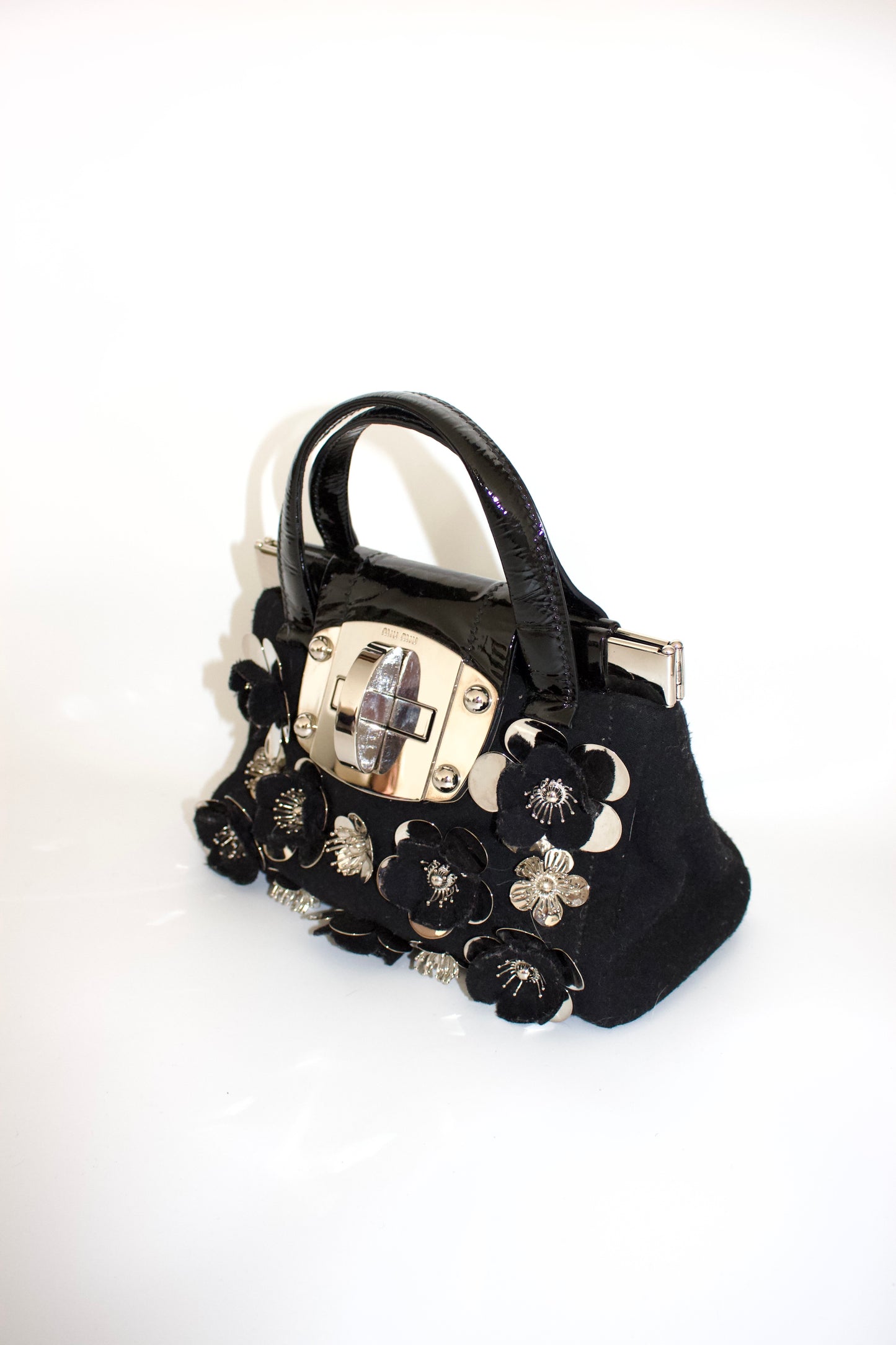 Miu Miu FW2010 black handbag with metallic flowers