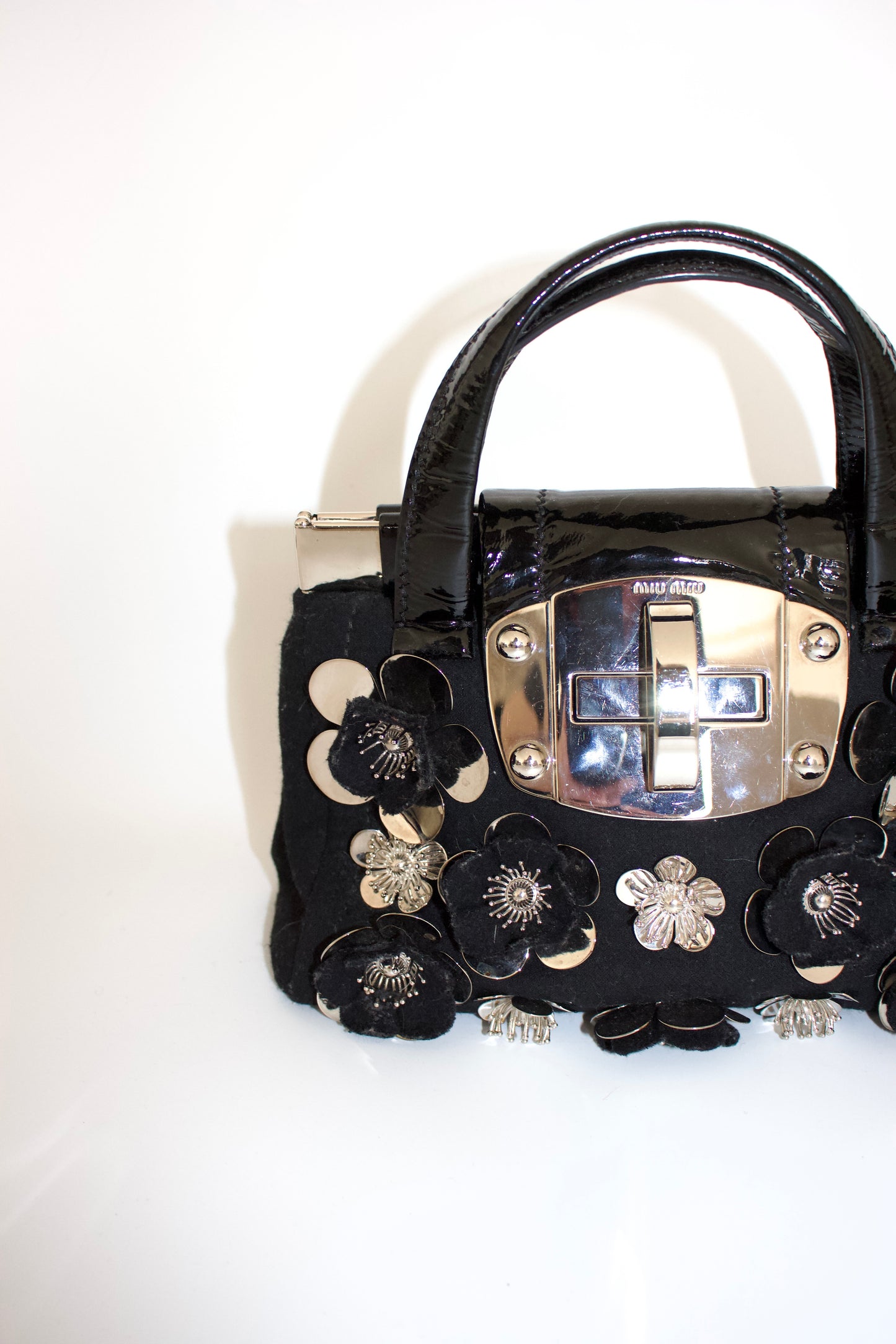 Miu Miu FW2010 black handbag with metallic flowers