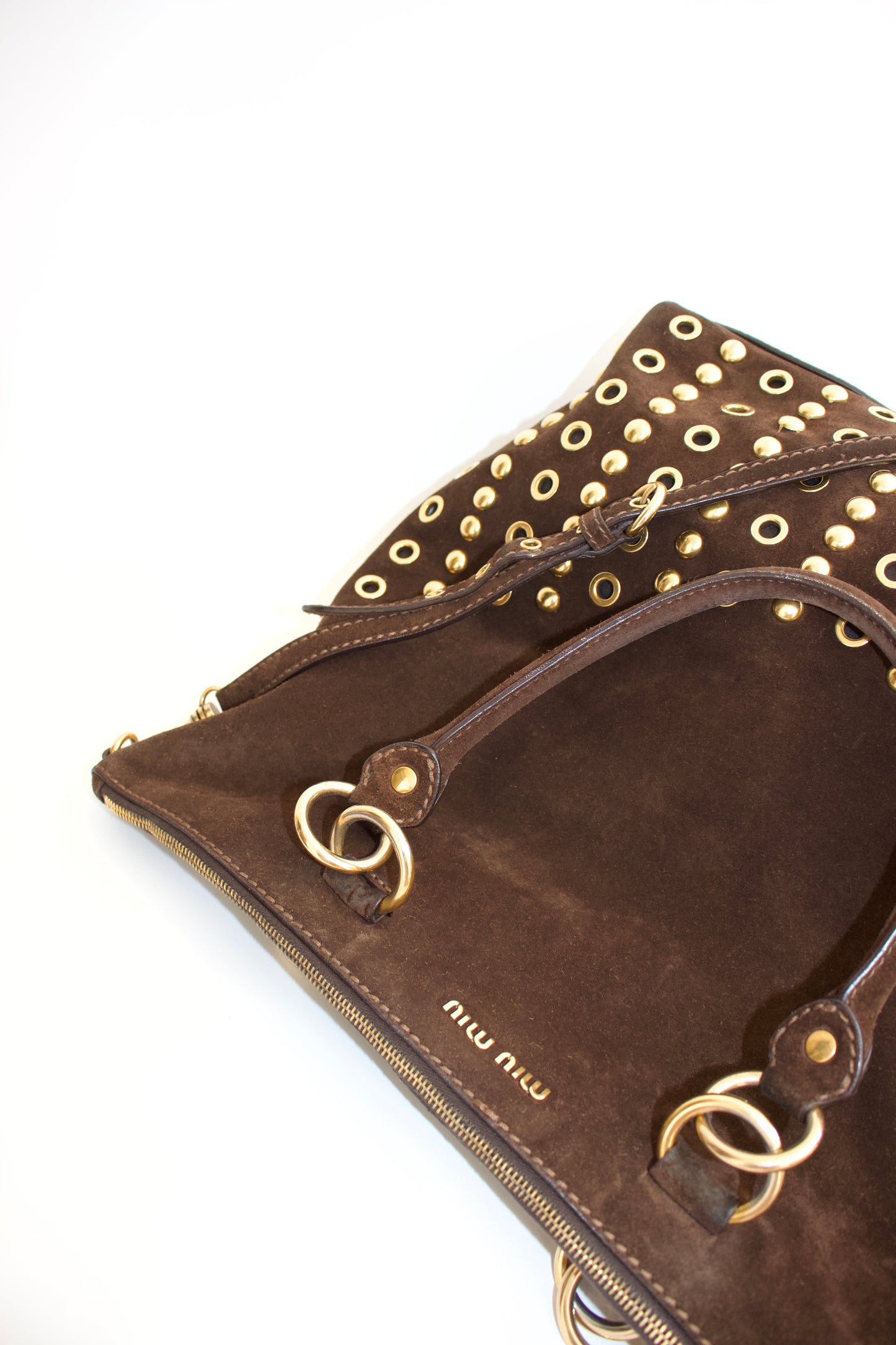 Miu Miu brown suede bag with golden eyelets and grommets