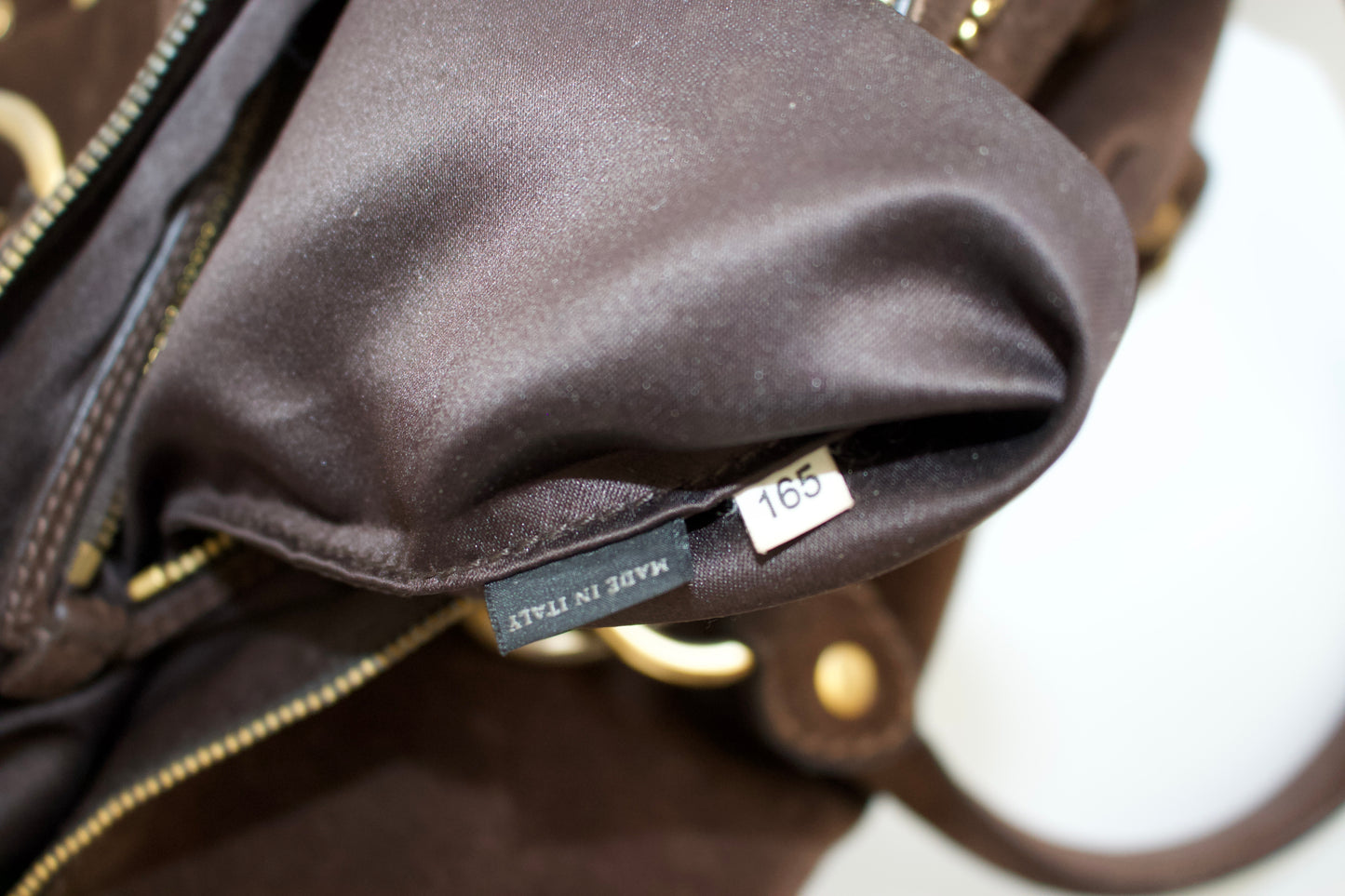 Miu Miu brown suede bag with golden eyelets and grommets