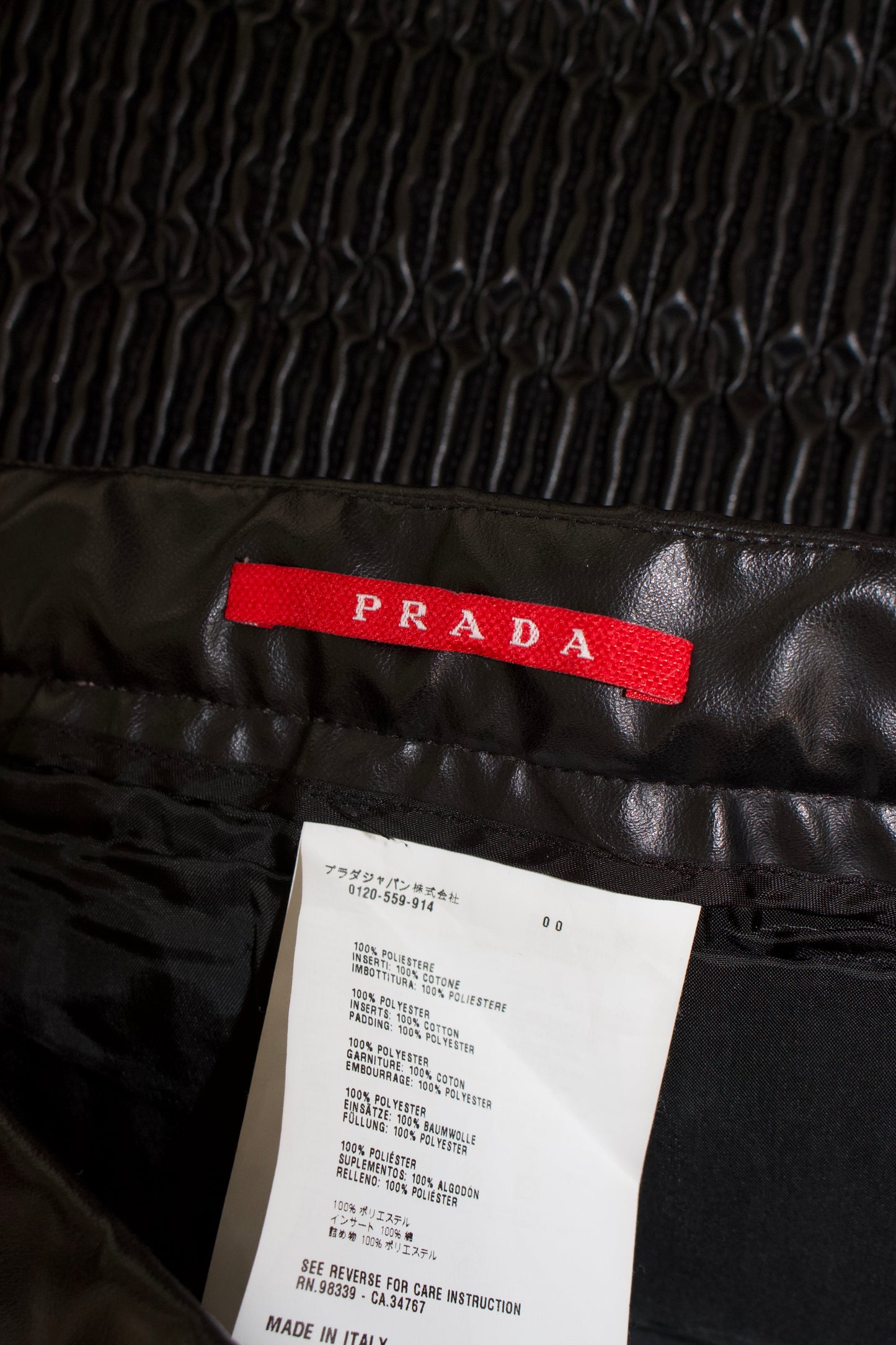 Prada 2000s black matelassé faux leather mini-skirt