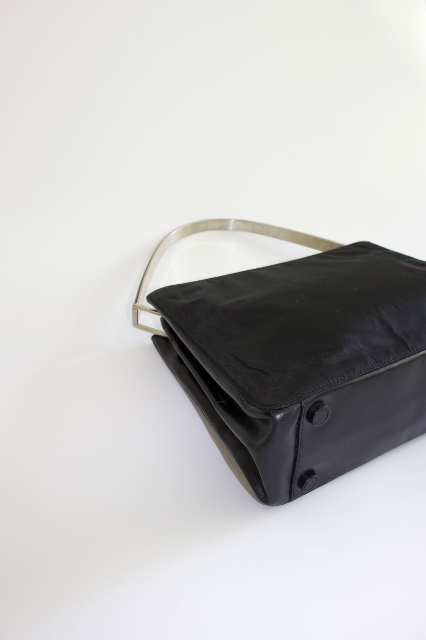 Prada FW 1998 black nylon shoulder bag with metal handle