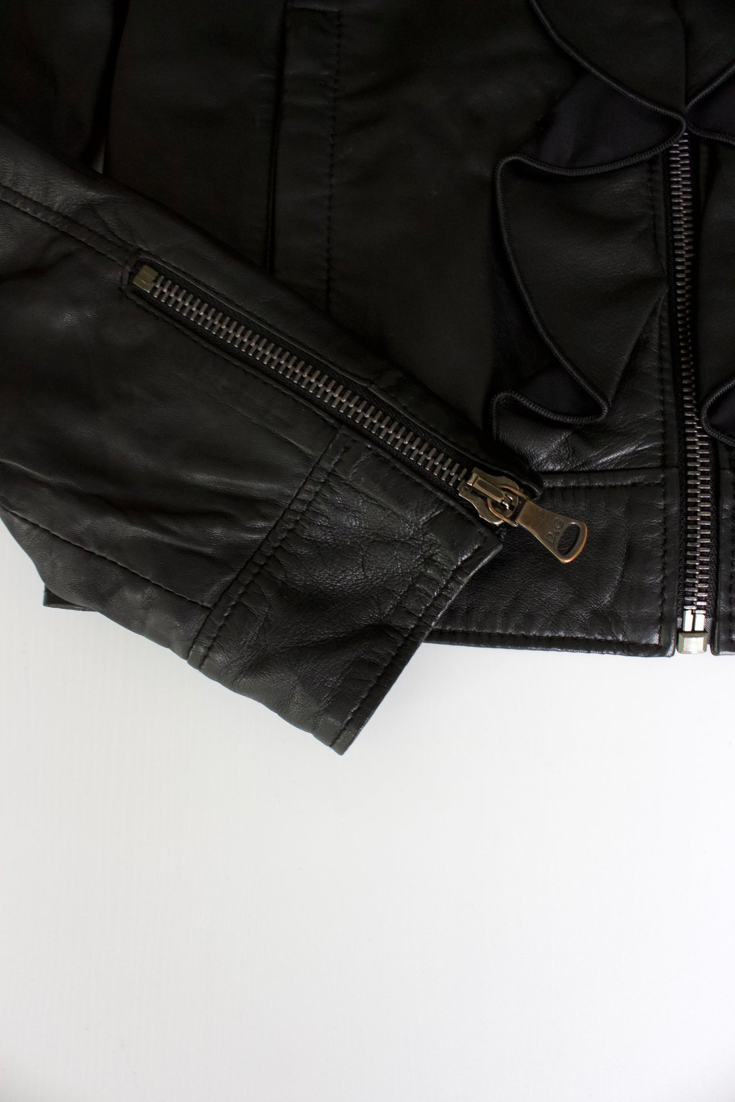 Dolce & Gabbana black leather jacket with ruffles