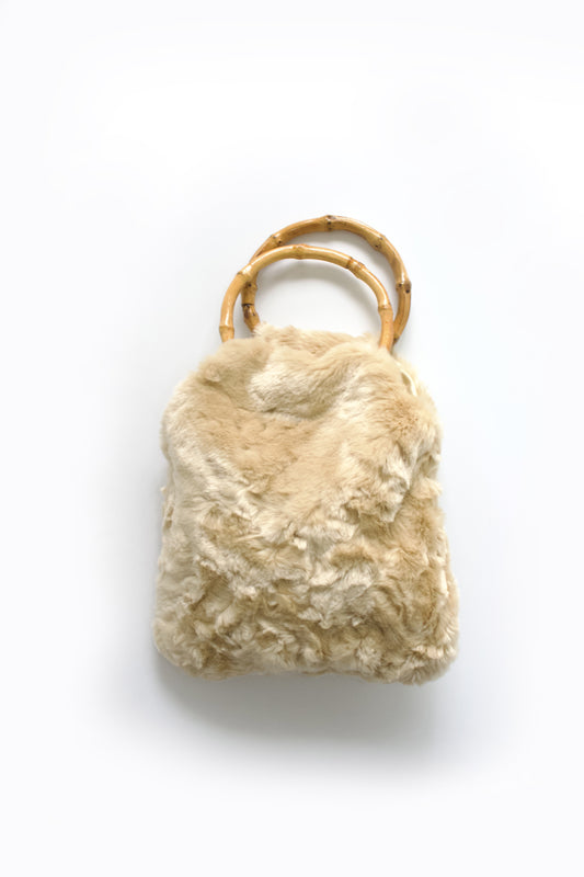La Perla cream fur bag with bambo handles