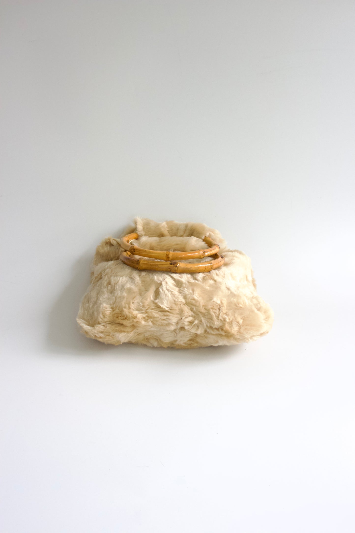 La Perla cream fur bag with bambo handles