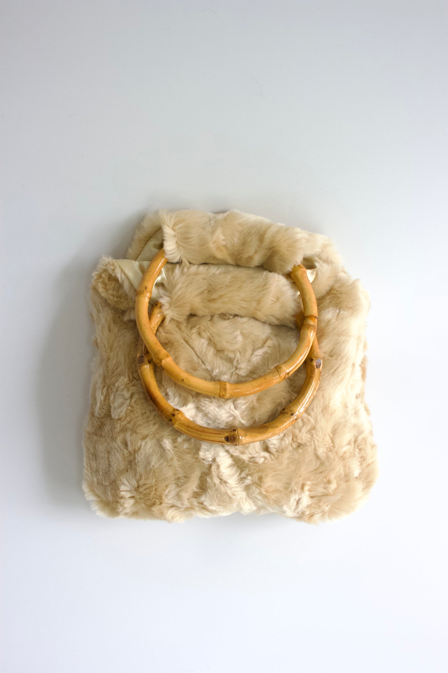 La Perla cream fur bag with bambo handles