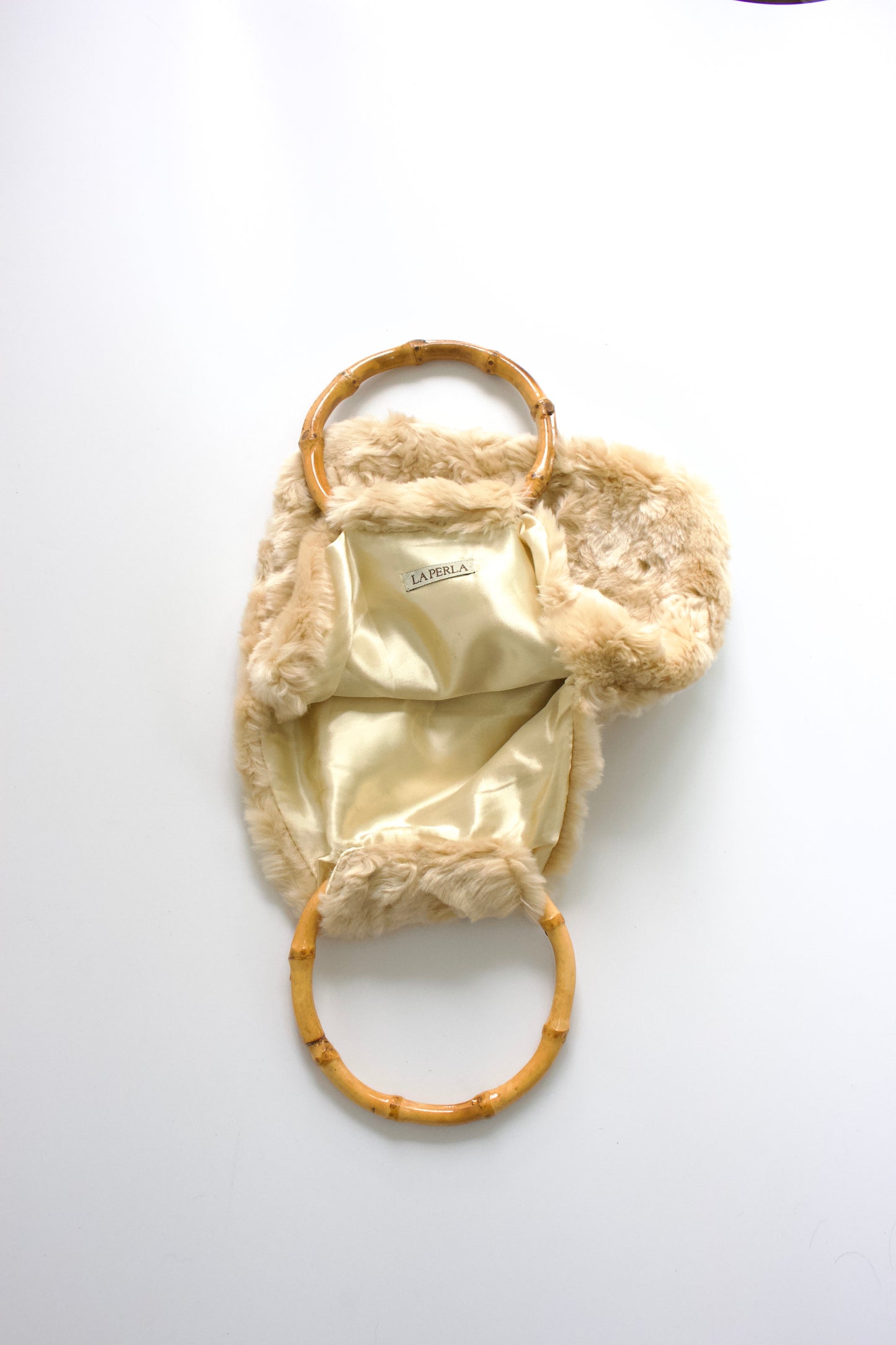 La Perla cream fur bag with bambo handles
