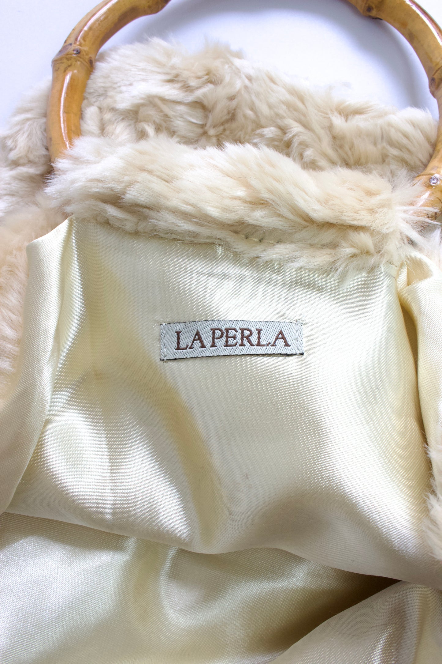 La Perla cream fur bag with bambo handles
