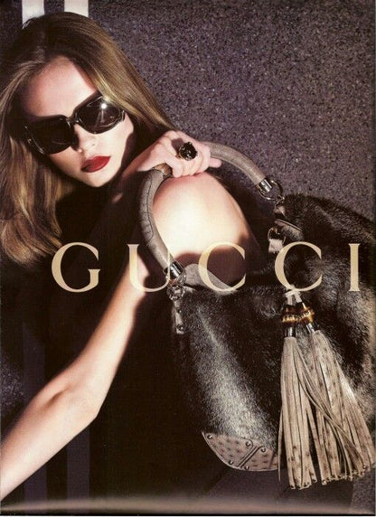 Gucci Indy brown monogram bag with mink fur tassels