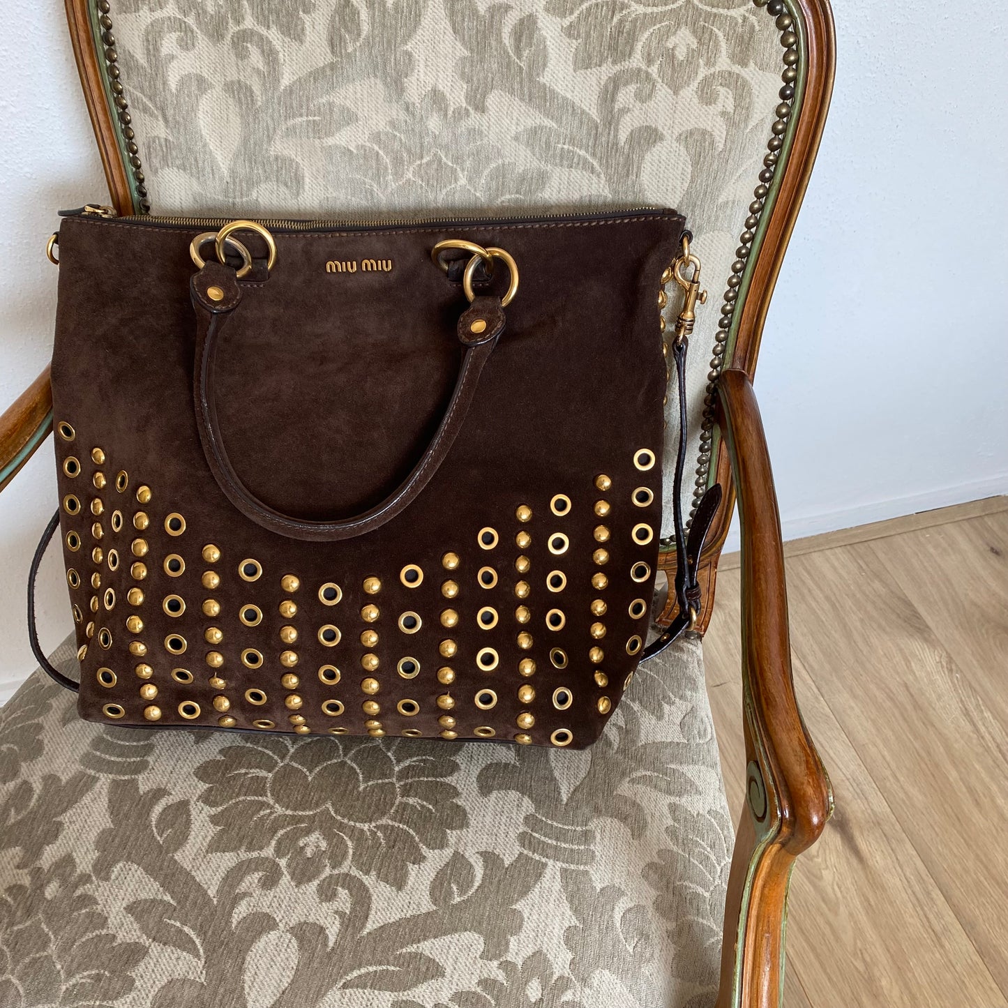 Miu Miu brown suede bag with golden eyelets and grommets