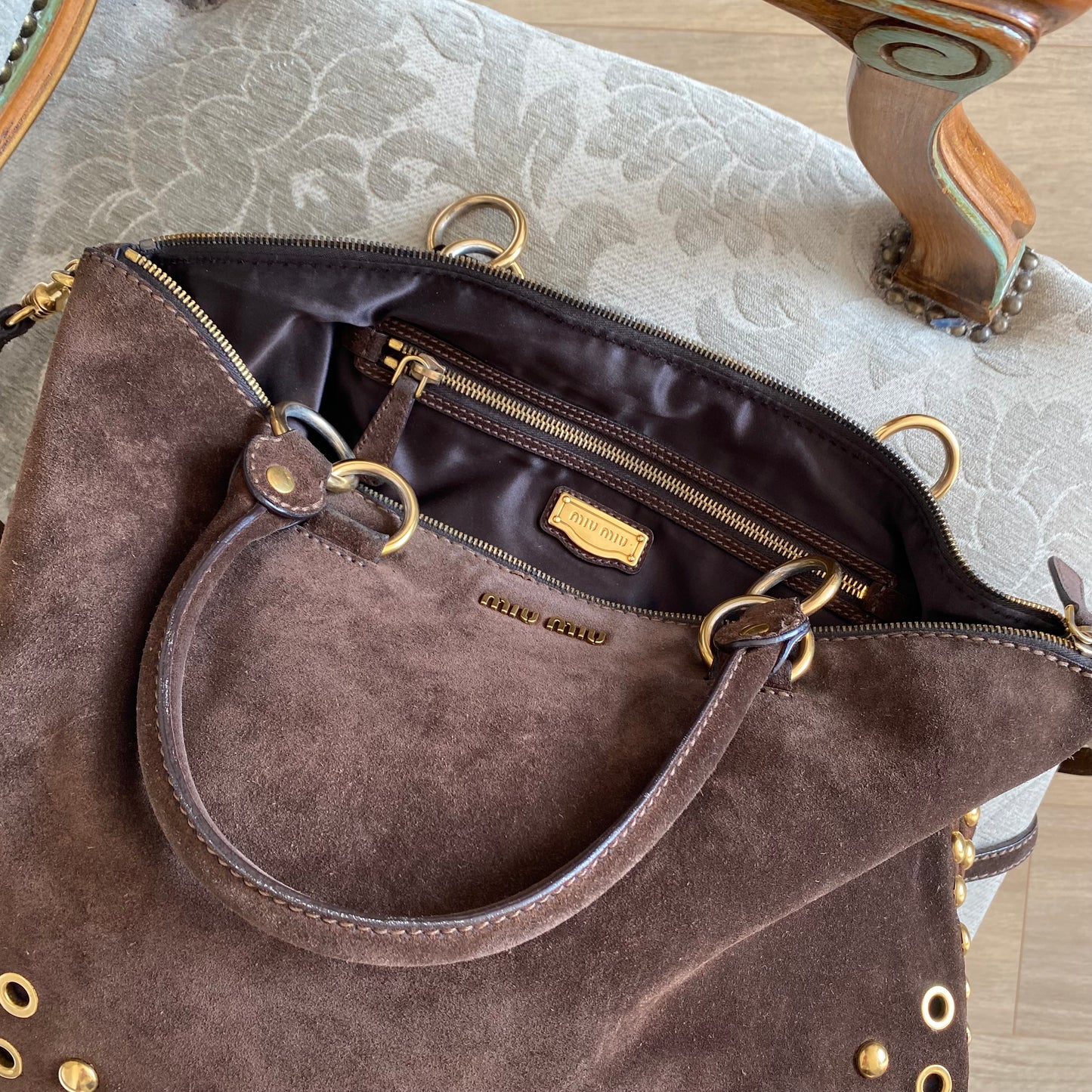 Miu Miu brown suede bag with golden eyelets and grommets