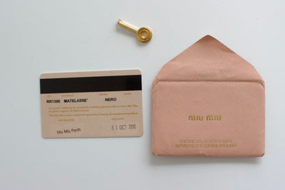 Miu Miu black matelasse Coffer crossbody bag