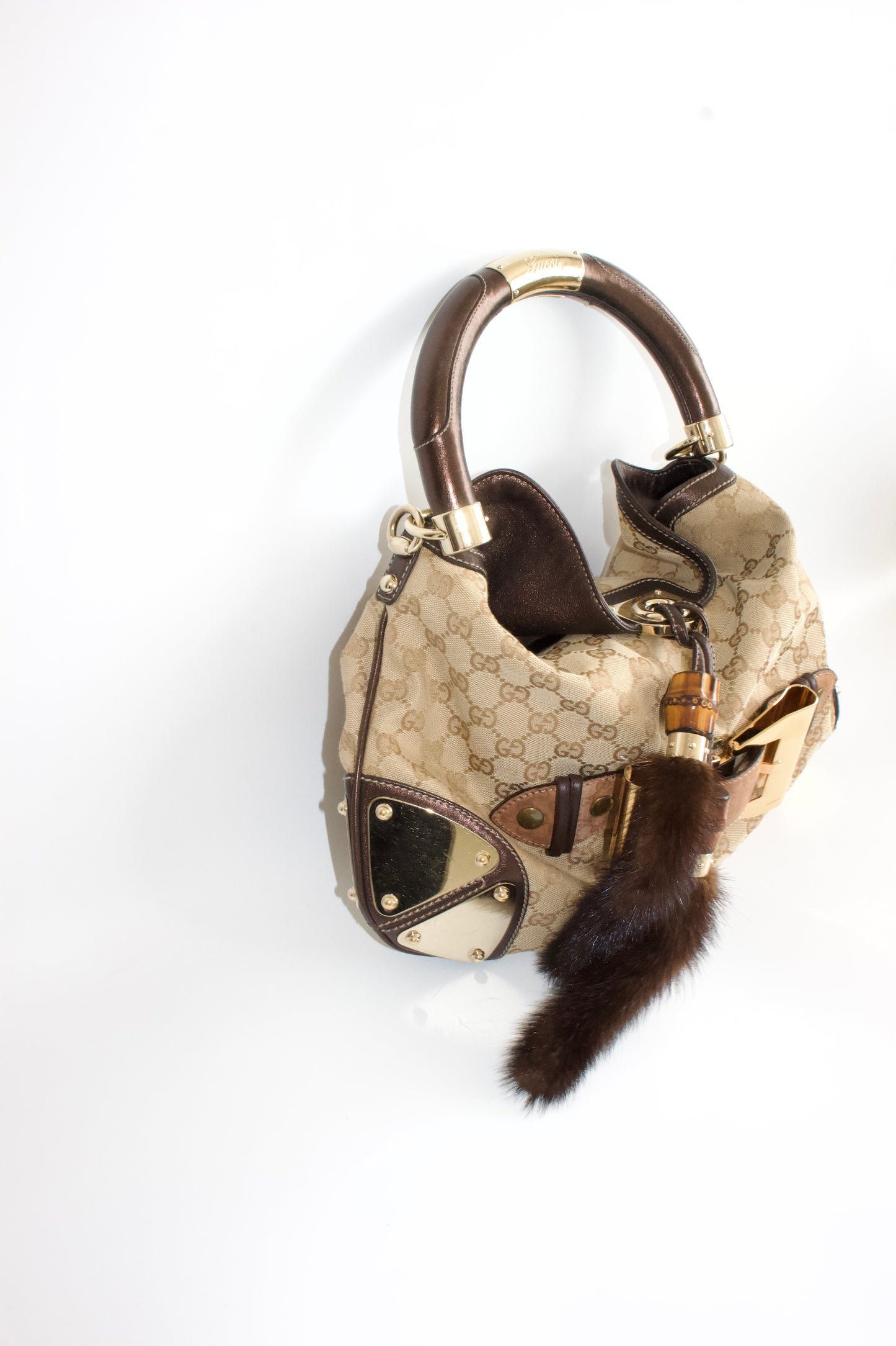 Gucci Indy brown monogram bag with mink fur tassels