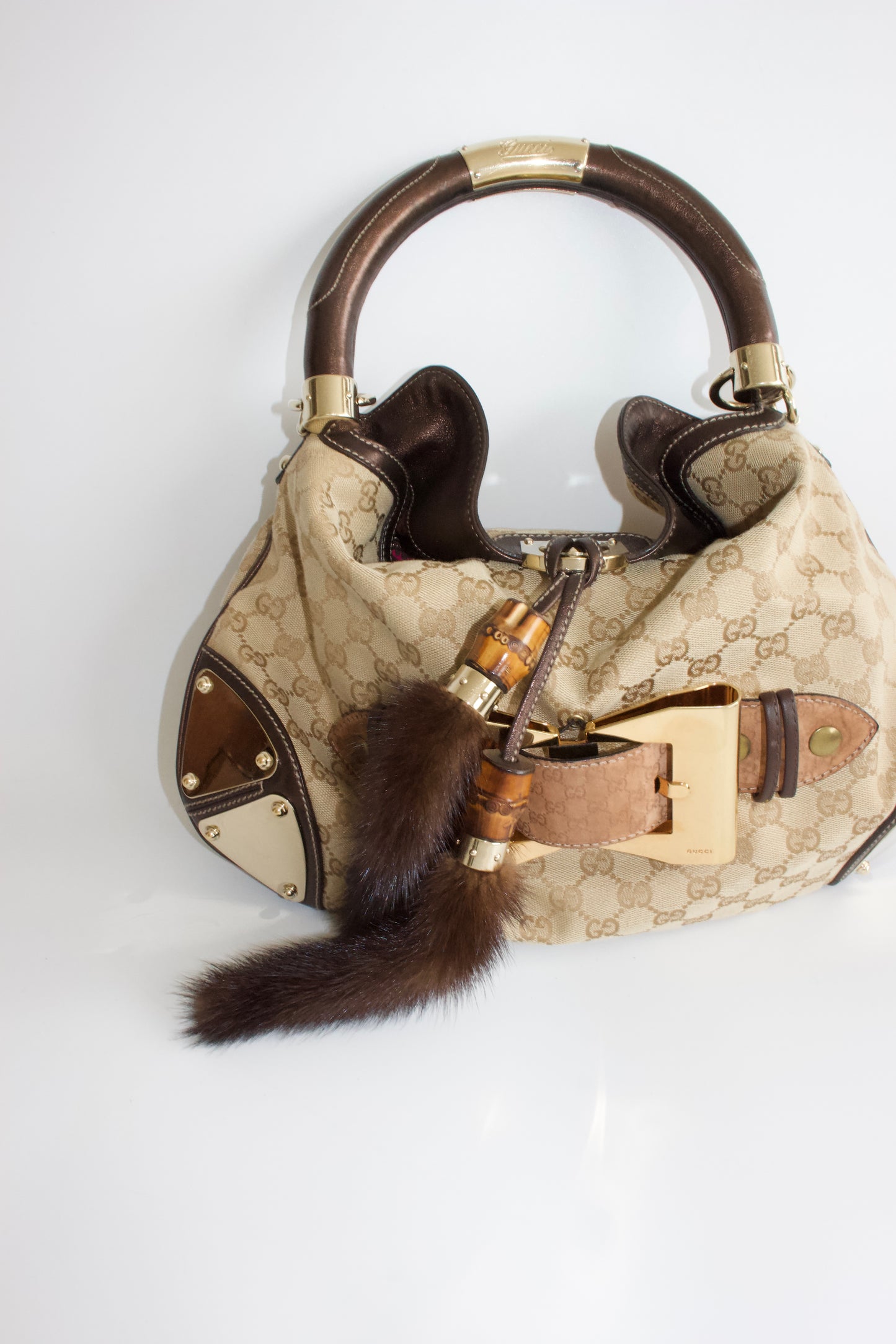 Gucci Indy brown monogram bag with mink fur tassels
