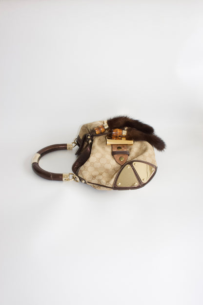 Gucci Indy brown monogram bag with mink fur tassels