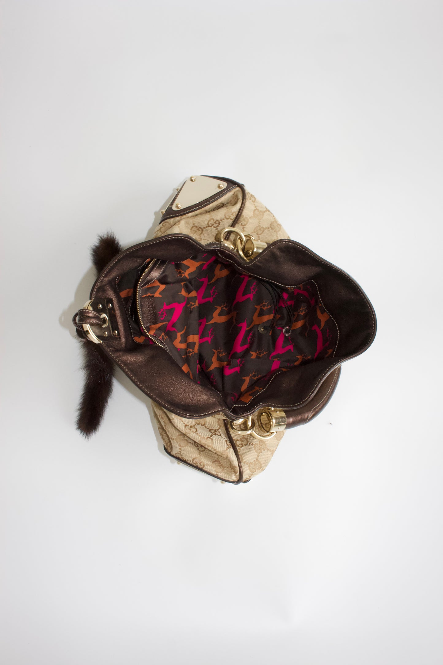 Gucci Indy brown monogram bag with mink fur tassels