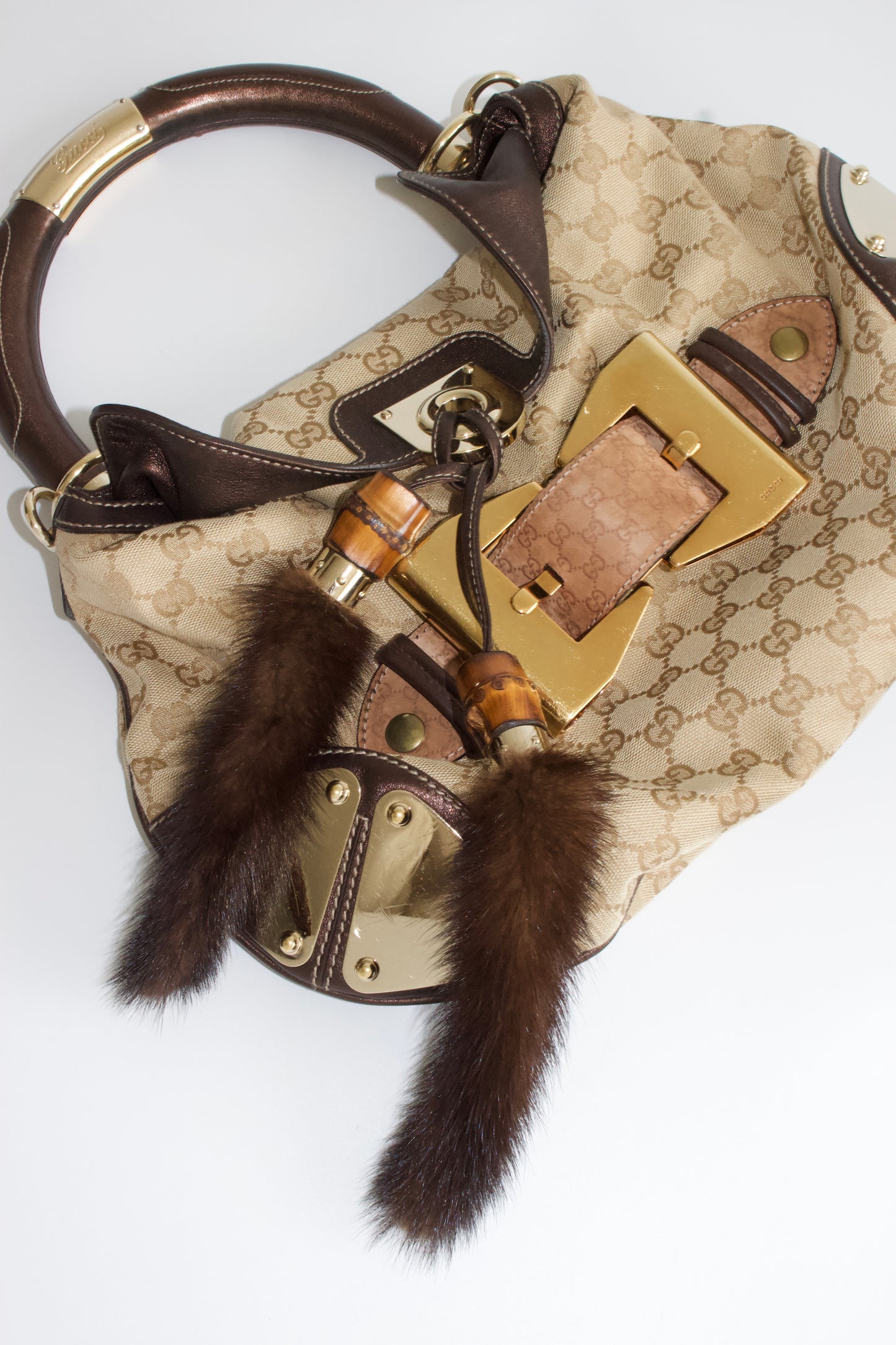 Gucci Indy brown monogram bag with mink fur tassels