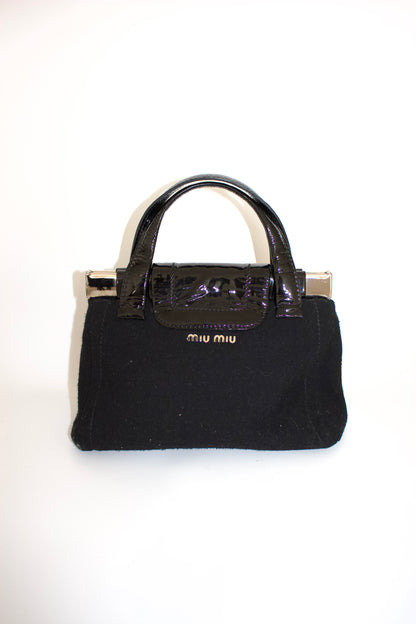 Miu Miu FW2010 black handbag with metallic flowers