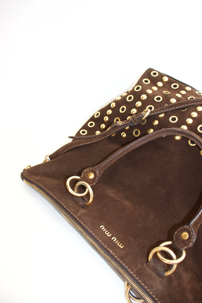 Miu Miu brown suede bag with golden eyelets and grommets